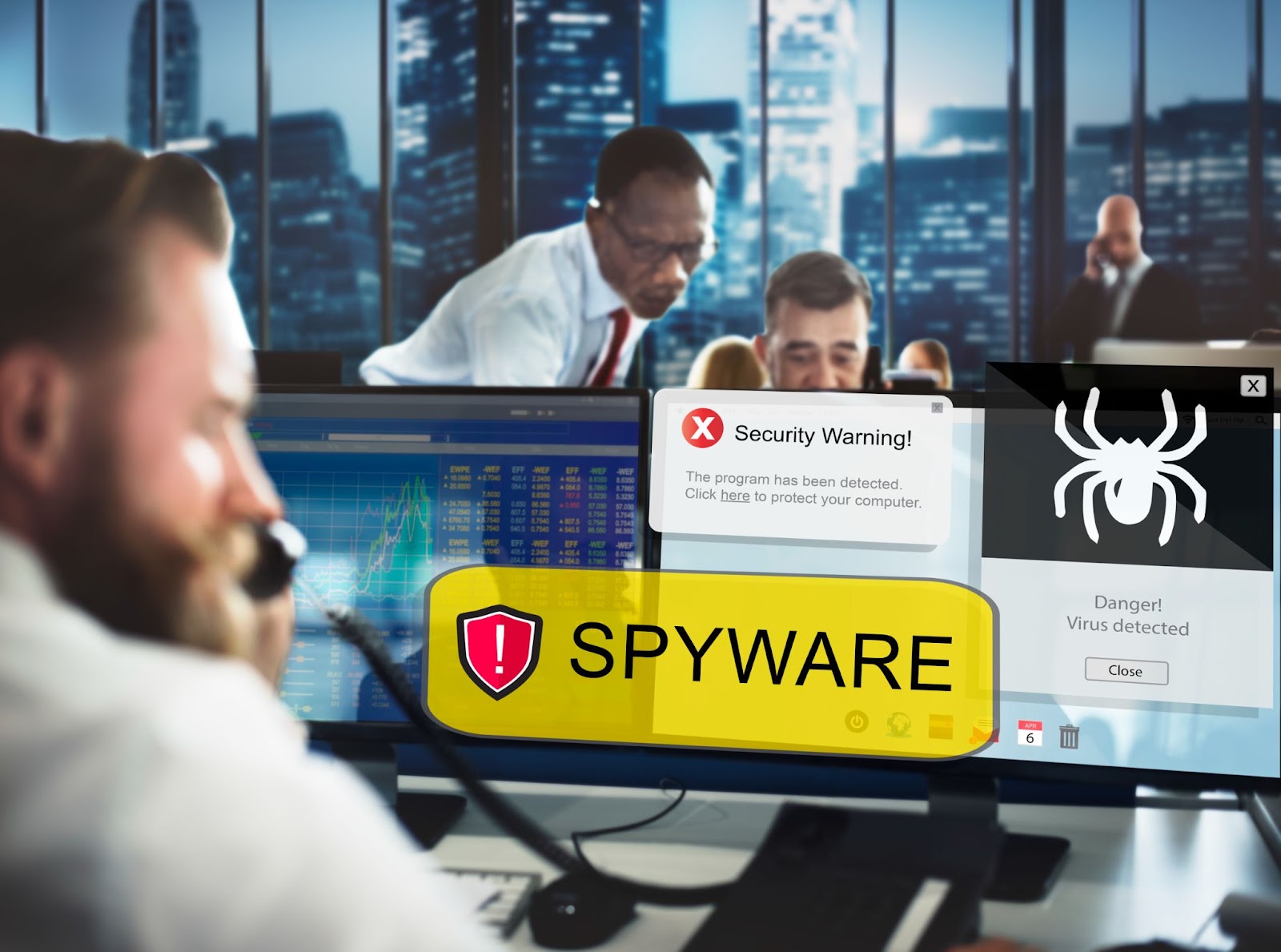 Security team monitoring screens for spyware and threats