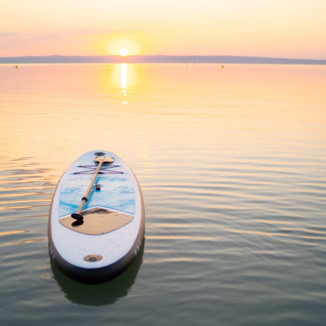 paddle board sunset