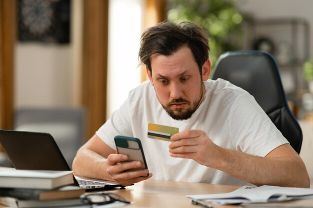 Man looking at his credit card