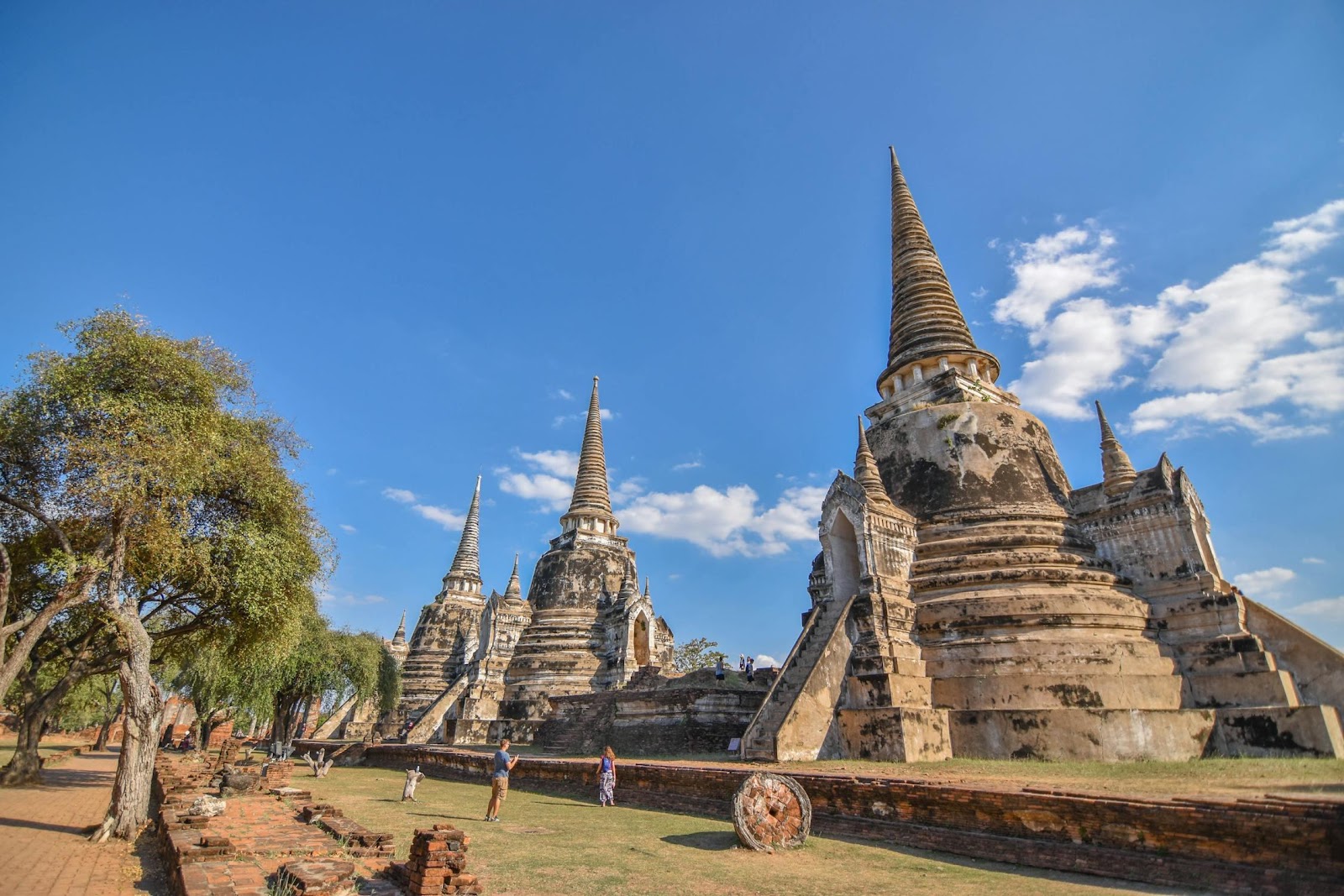 A group of pagodas with trees and blue sky

Description automatically generated