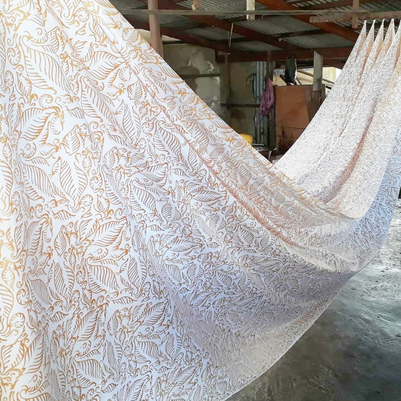 An image showing a prewax batik fabric in tan nautical fern for batik boutique