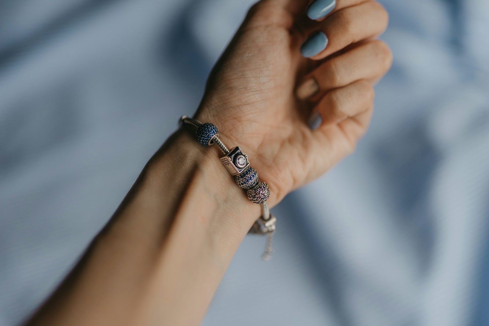 person wearing silver and black bracelet