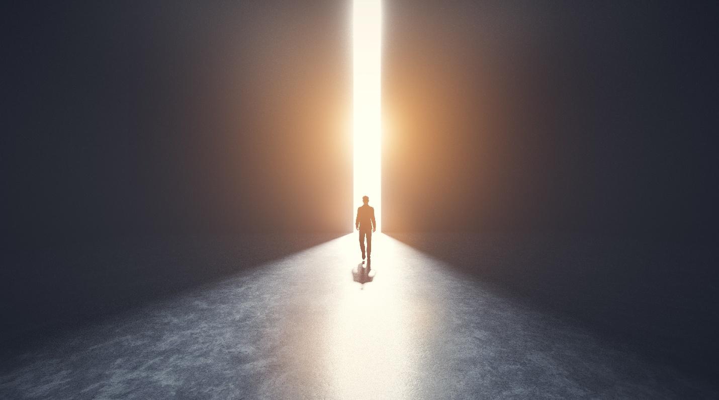 A person standing in front of a light

AI-generated content may be incorrect.
