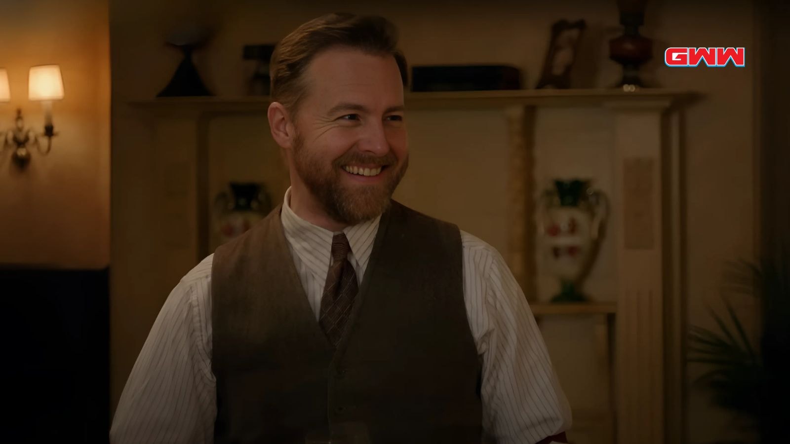 Samuel West as Siegfried Farnon, smiling in a casual setting.