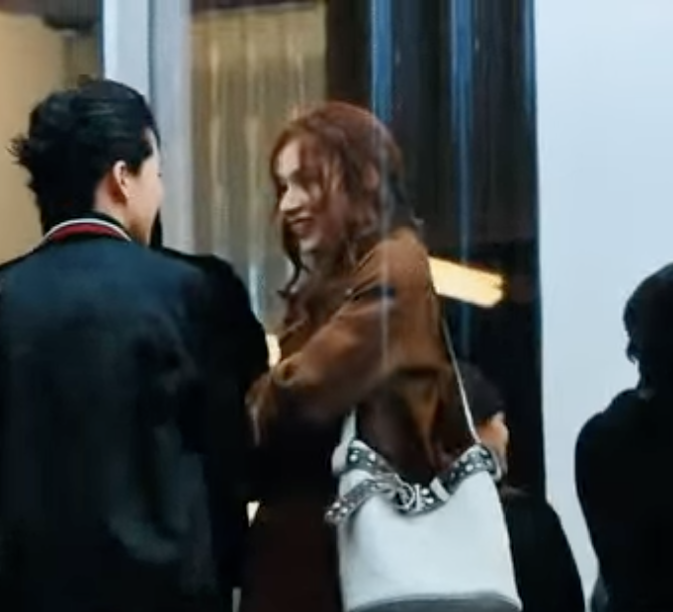 A picture of TWICE Sana and a man in PRADA Men's Fashion Week Fall/Winter 2025