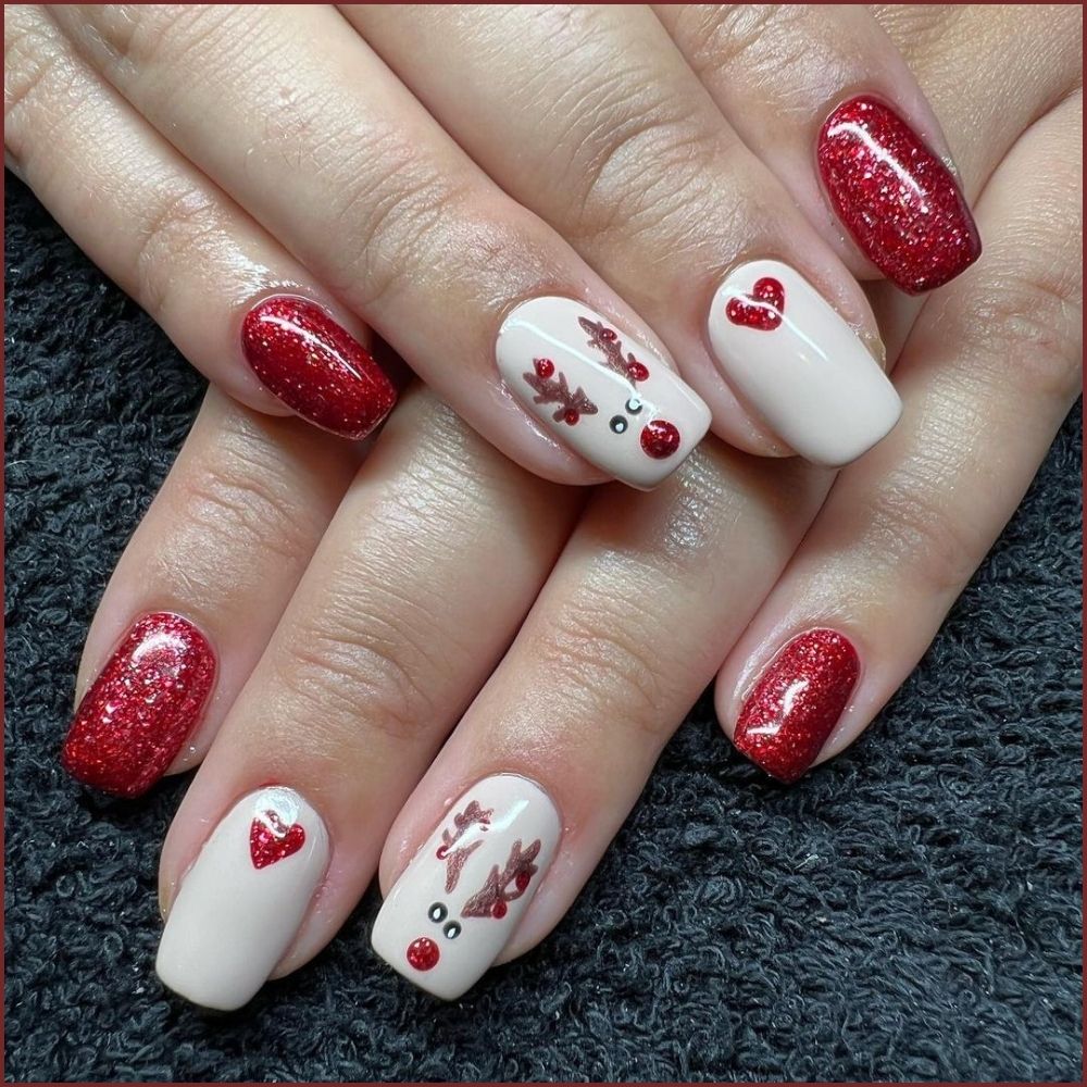 Close up of hands having Christmas red nails with Rudolph Red Glitter Nails