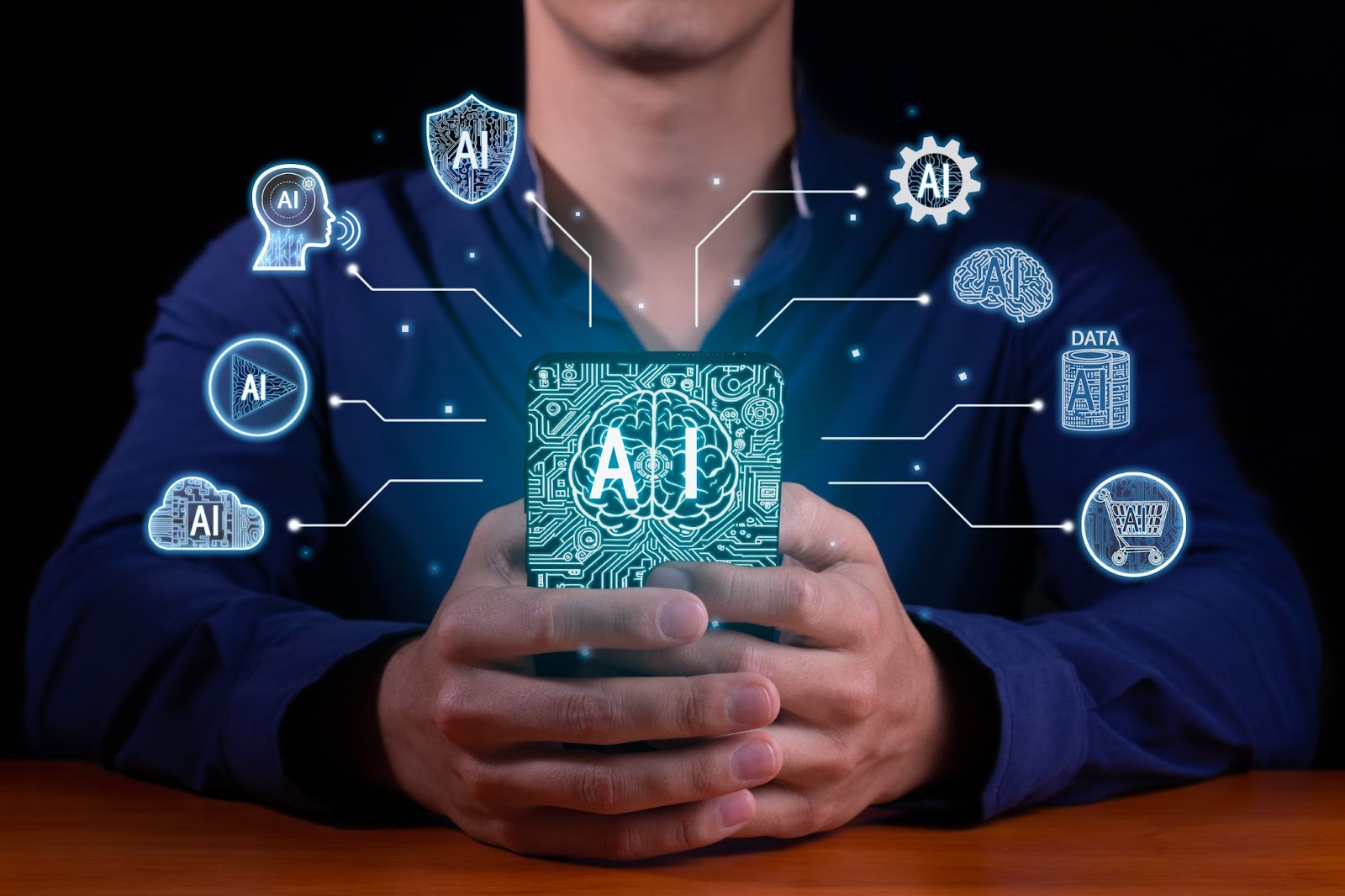 Man holding a phone with the word “AI” on the back with lines branching out with various symbols. 