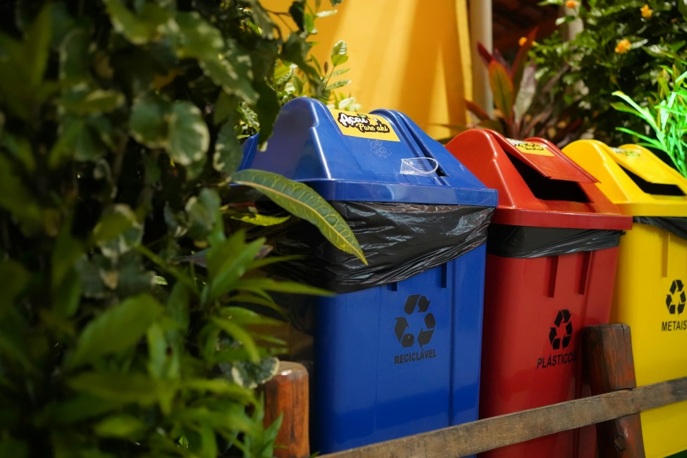 Recycling bins lined up outside a home.