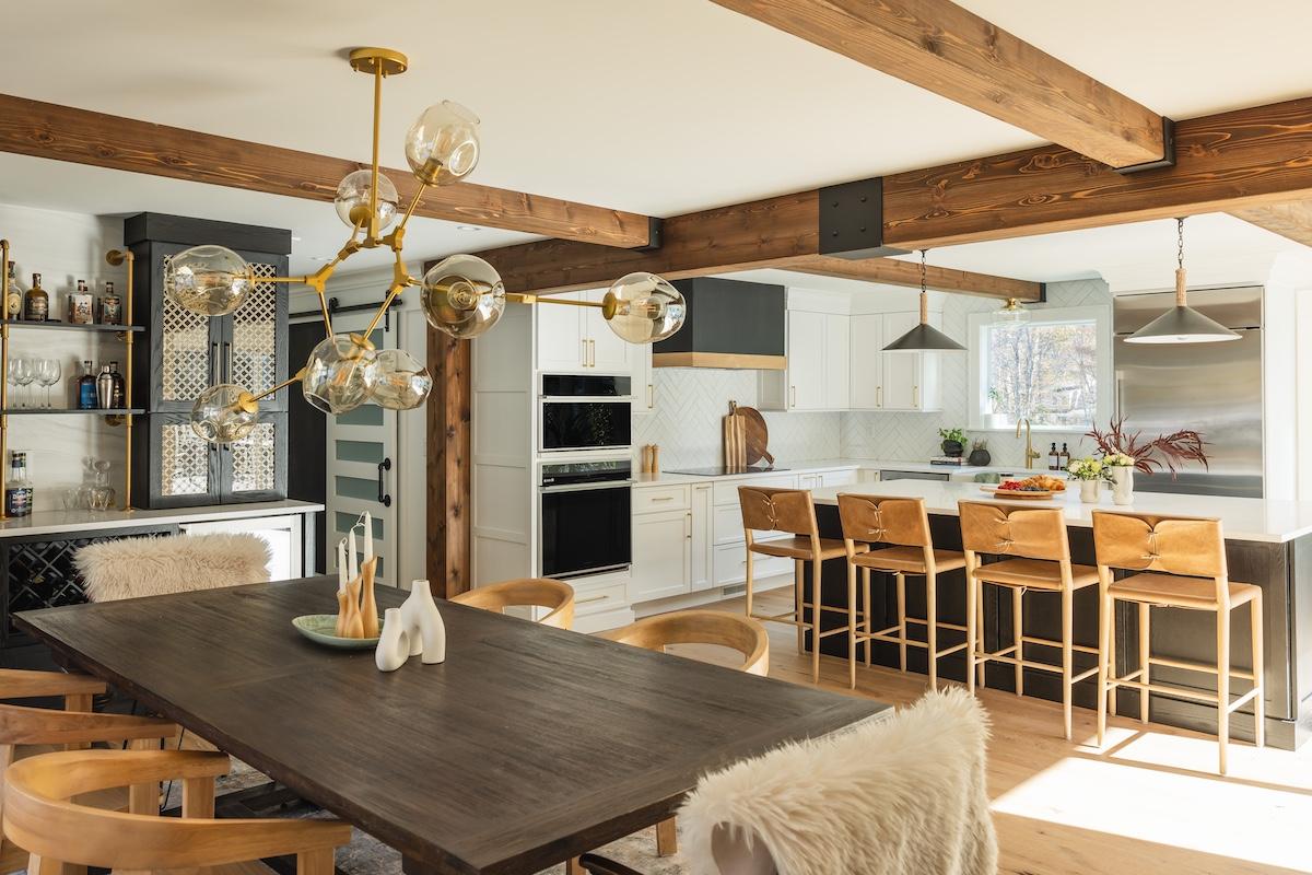 A kitchen/dining room with Wire Brushed Wood Beams in Warm Natural