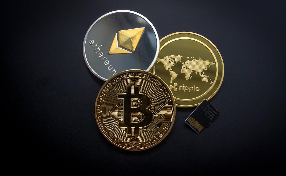 Free Ripple, Etehereum and Bitcoin and Micro Sdhc Card Stock Photo