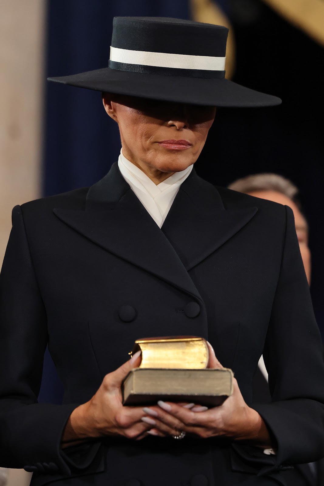 Melania Trump holding two bibles during Donald Trump's second inauguration. | Source: Getty Images