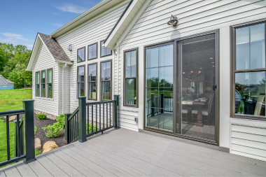 attached decks vs floating decks building the right outdoor living space composite deck with indoor outdoor sliding glass door transition custom built michigan