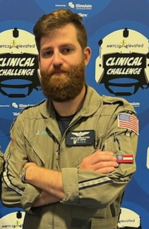 Jason Herman in front of Clinical Challenge banner