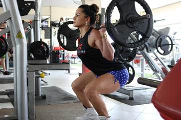 A person lifting weights in a gym

AI-generated content may be incorrect.