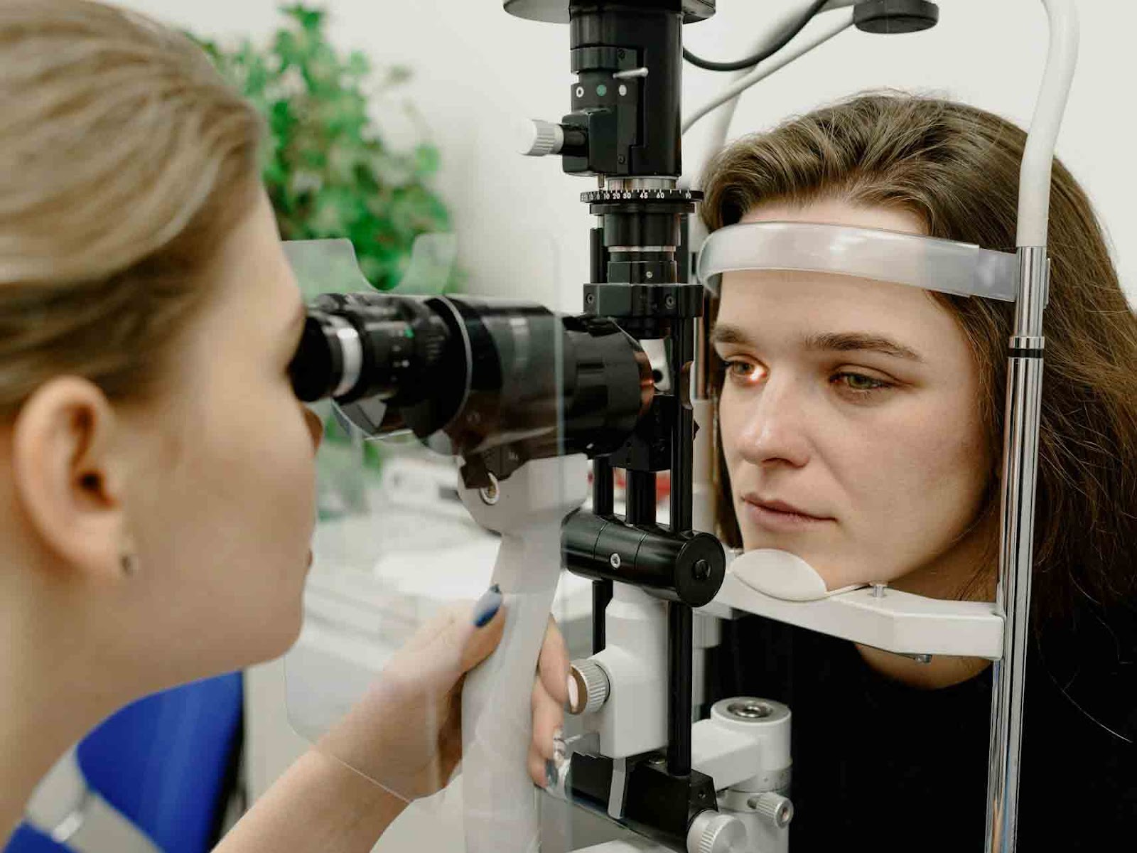 Girl seeing an optometrist because she has vision problems from stress.