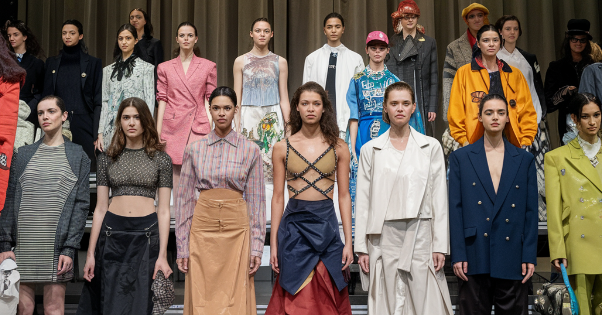 A diverse group of women showcasing various outfits on the runway, exemplifying the theme of Dress Code.