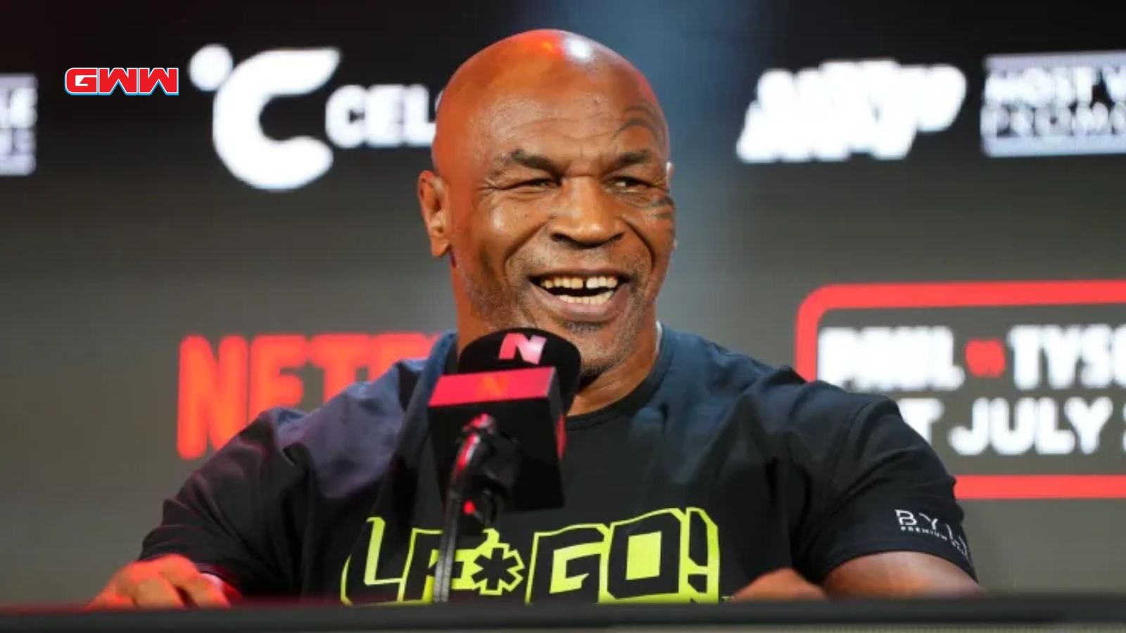 Mike Tyson laughing in Jake Paul vs. Mike Tyson conference