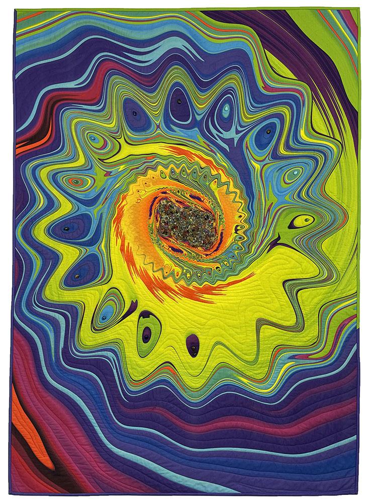 A colorful quilt with a swirl of colors

Description automatically generated