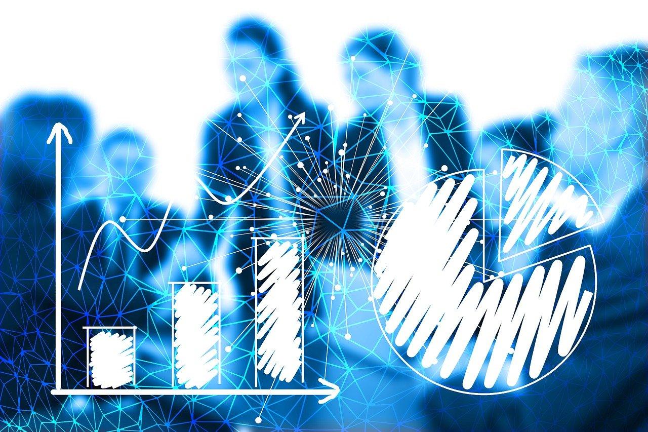 Digital charts and graphs overlayed on a business meeting scene.