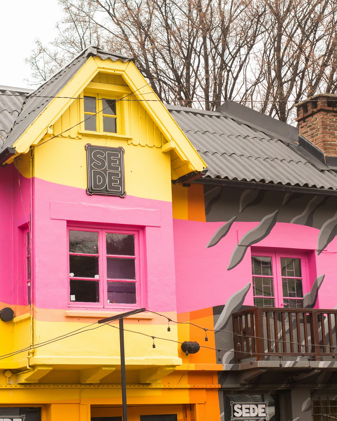 Professional painter applying paint evenly to a house exterior