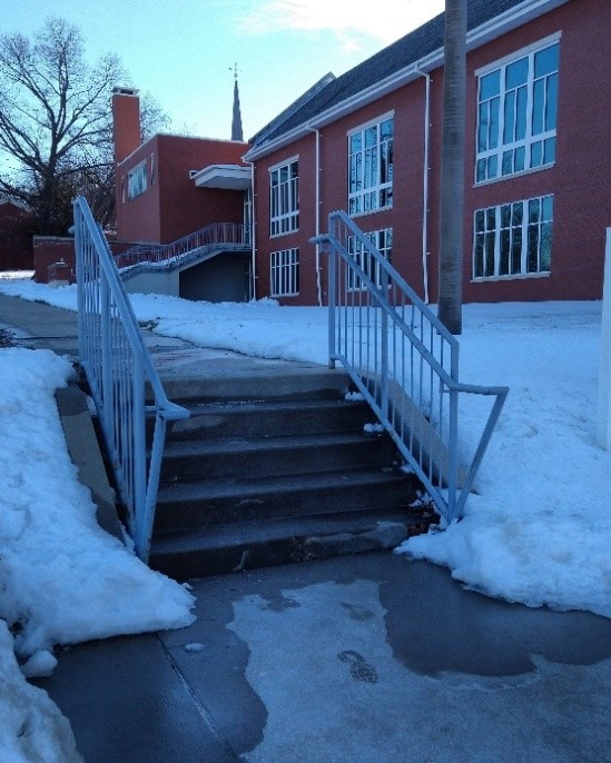 A building with snow on the ground

Description automatically generated