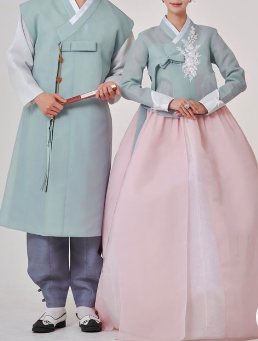 This contains an image of  a man and woman wearing the  Korean Wedding  attire 