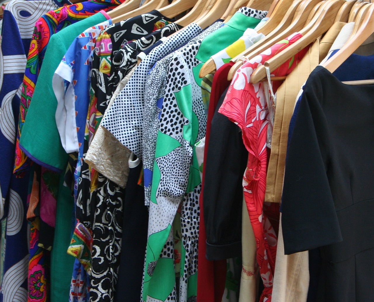 Mismatched clothing on a rack. 