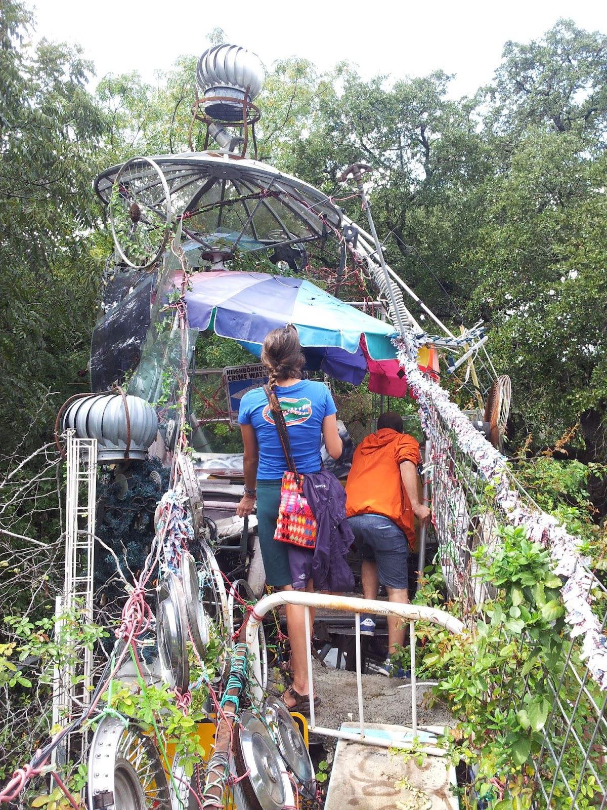 Two people entering the Cathedral of Junk.