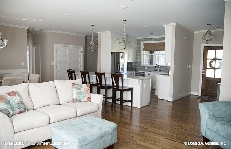 The foyer opens up into the living room and kitchen.