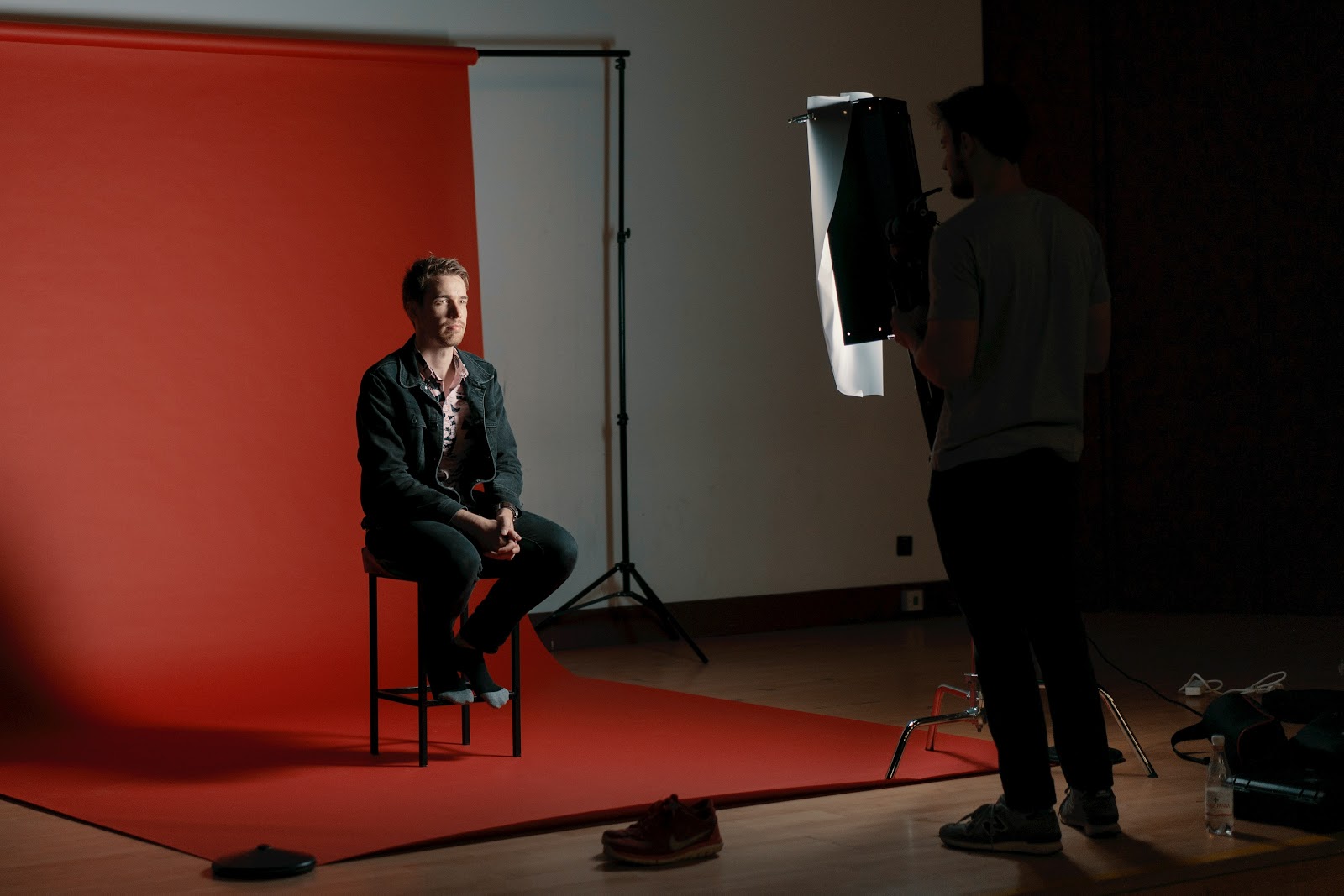 A studio setup for a professional photoshoot of a man