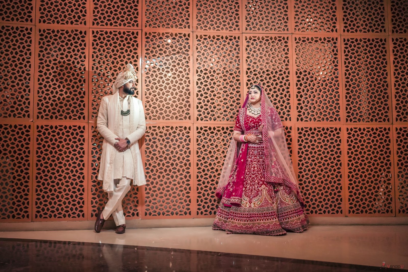 Groom looking at his bride with admiration, a timeless moment in wedding photography trends for 2025