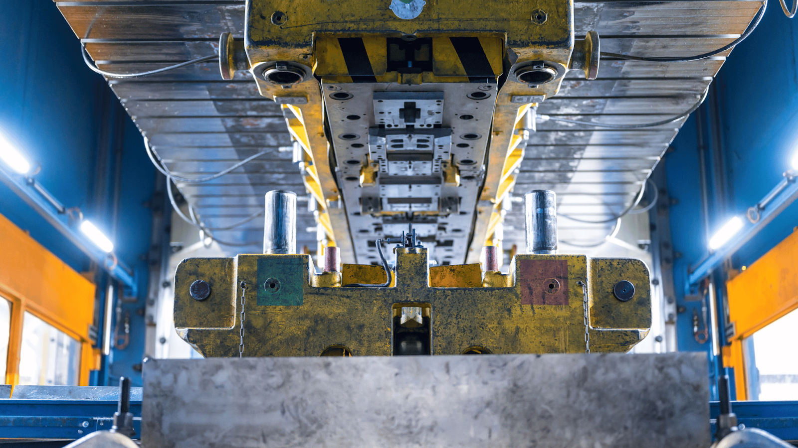 Close-up of a die in a stamping machine, showing the complex tooling used in metal stamping.