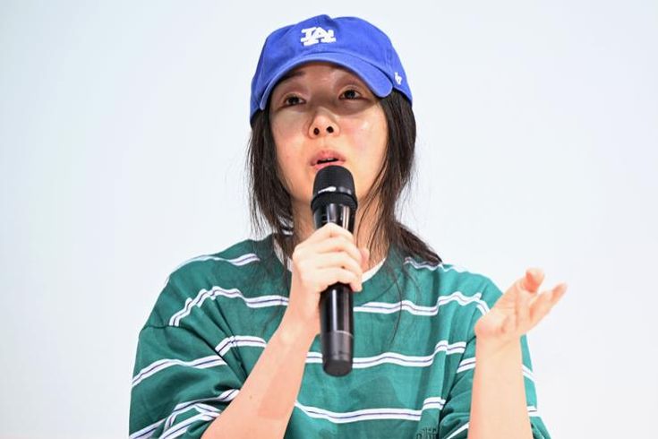 This contain an image of Min Hee-jin, the former CEO of K-pop label Ador, filed legal action against executives of Belift Lab on Friday, accusing the agency behind rookie girl group ILLIT of defamation, her lawyer said.