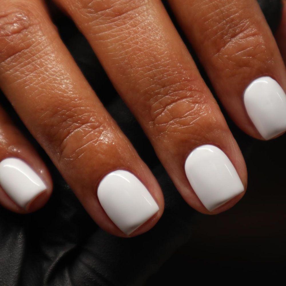 Simple White Nail Design having Short white nails