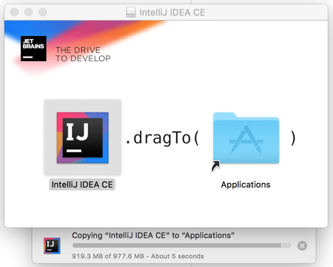 Screenshot showing the installation process of IntelliJ IDEA Community Edition on macOS. The image instructs users to drag the IntelliJ IDEA CE icon into the Applications folder to install the application