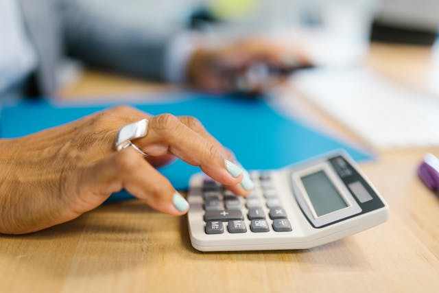 person using a calculator