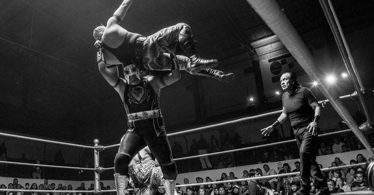 Thrilling black and white capture of a Lucha Libre wrestling match in Mexico.