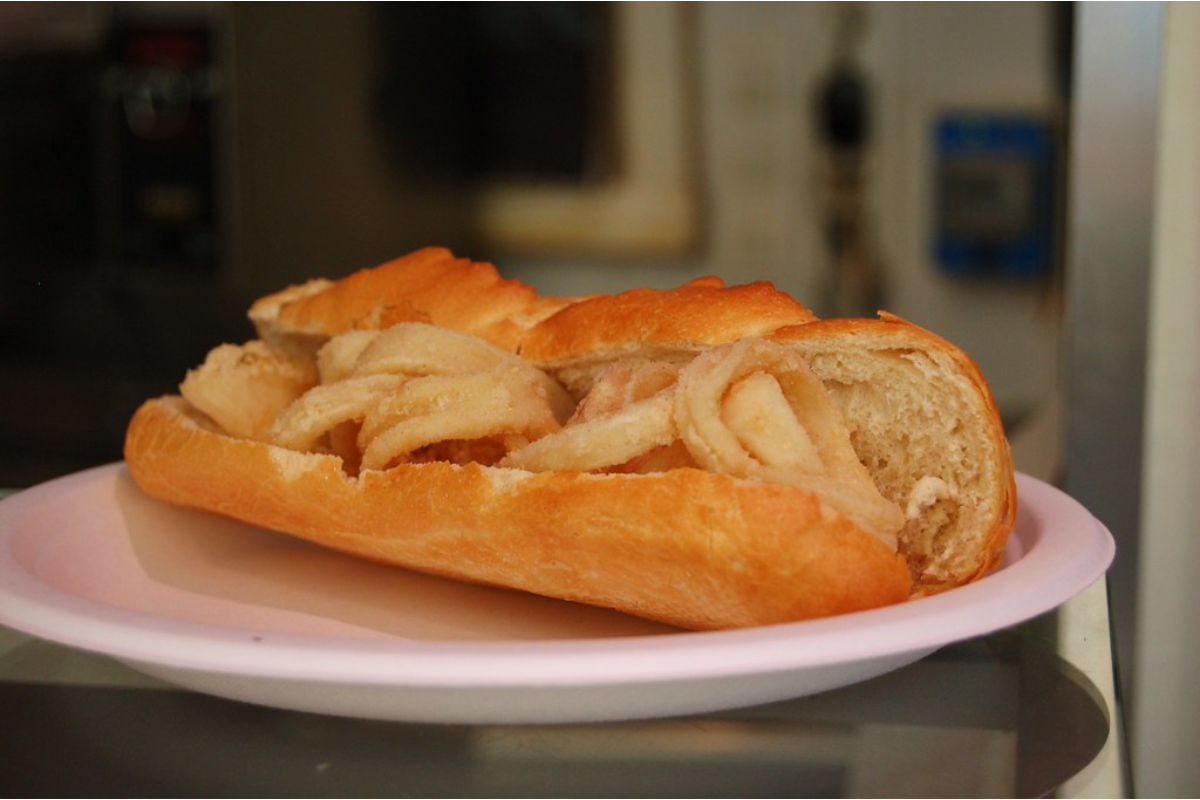 Brown bread and some food between the bread