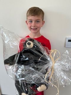 Abel holding a prize