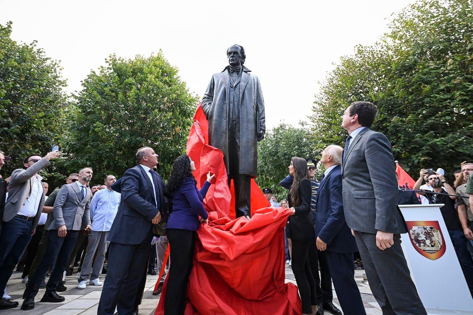 May be an image of 9 people and monument