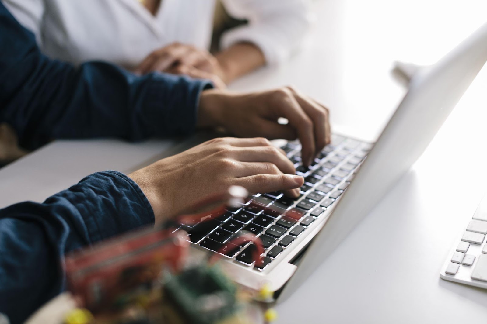 Person typing on laptop