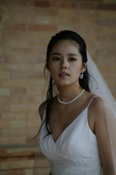 This contain Han Ga In  wearing a wedding dress and veil