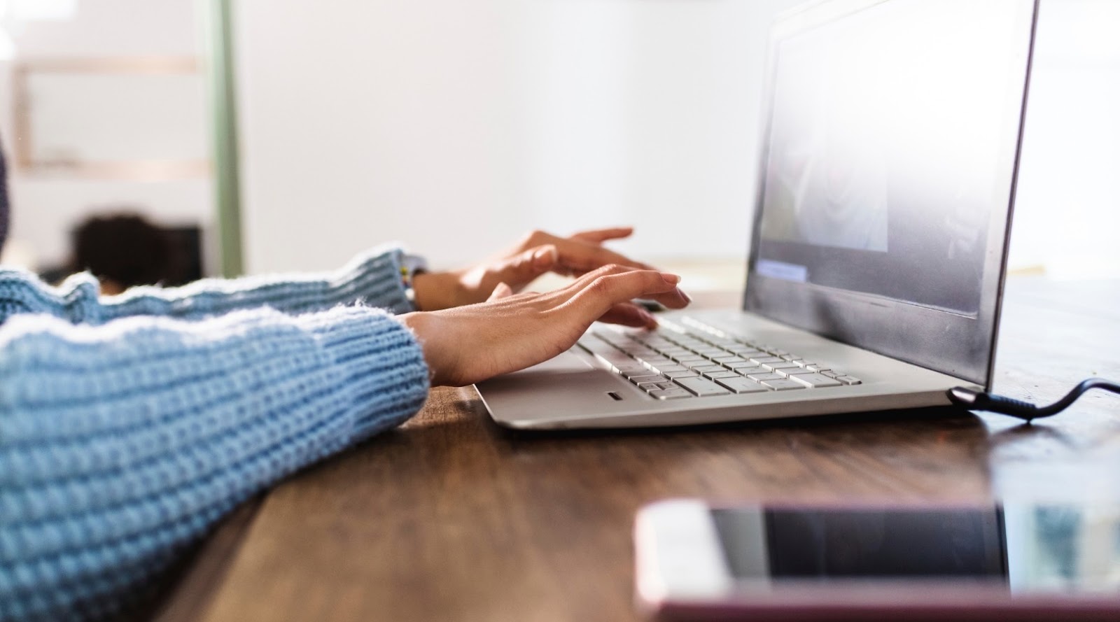 Hands typing, researching fast food alternatives or working with a registered dietitian in Nepean for health conditions