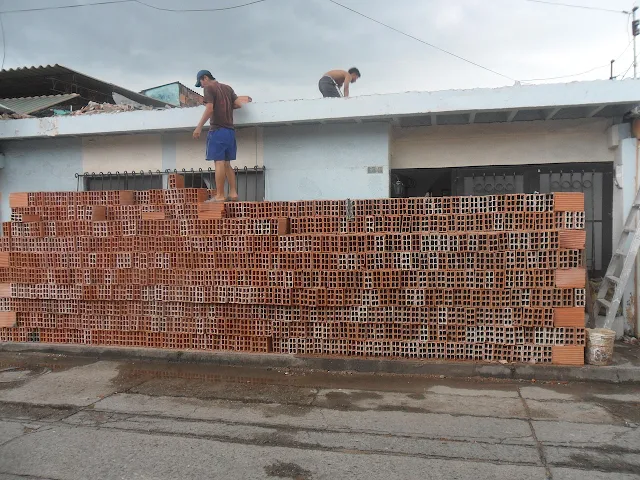 men building wall