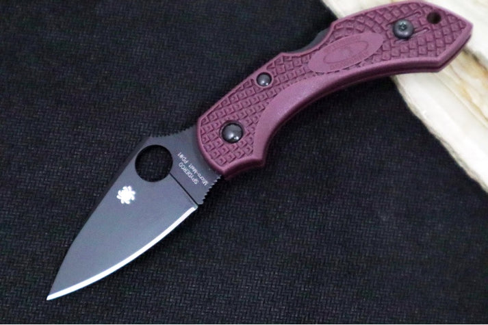 An image showing a limited-edition Spyderco Dragonfly 2 Sprint Run. This premium knife features a leaf-shaped blade and burgundy FRN bi-directional scales.