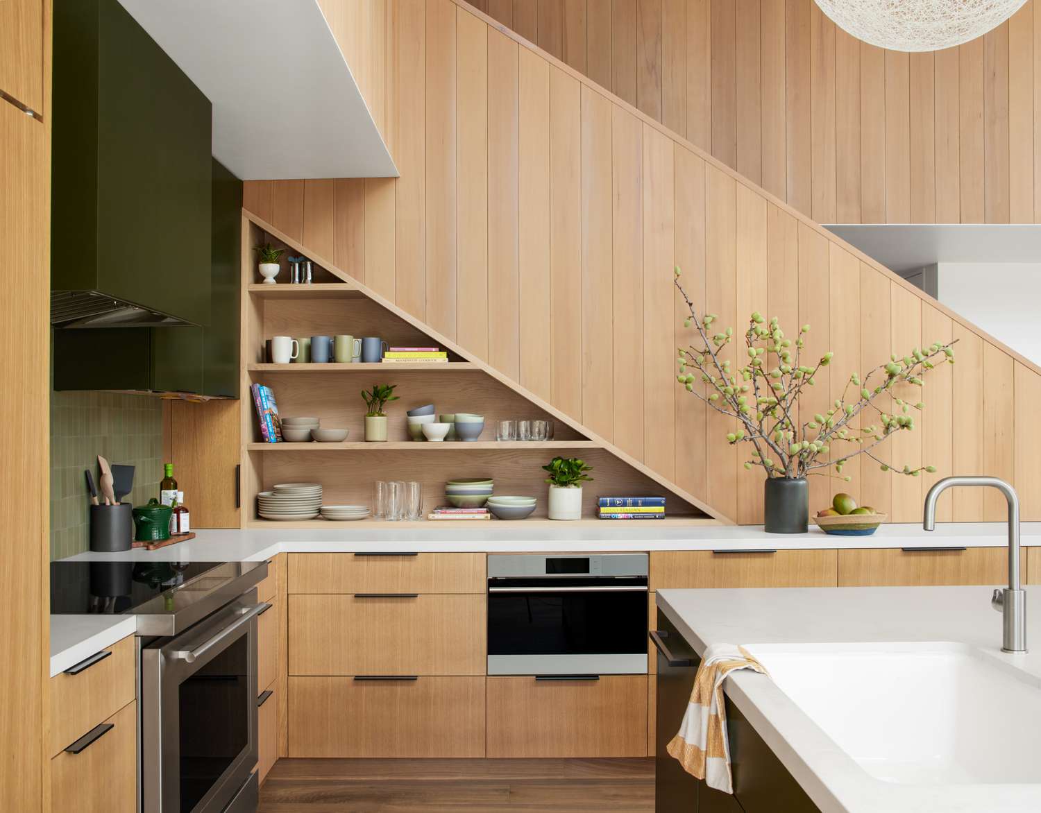 Modern kitchen interior design with wooden cabinetry and cabinets. 