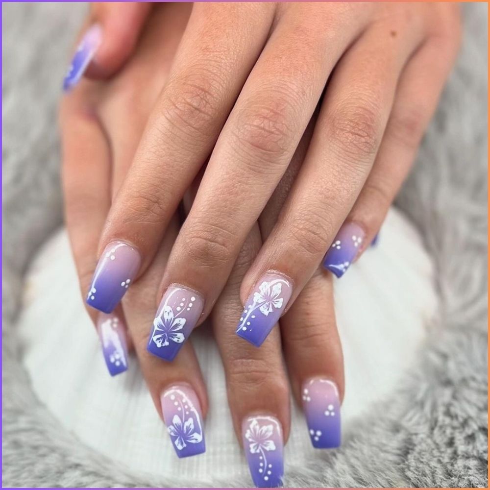 Close up of hands with flowered designed blue nails having Blue-to-Purple Ombré with Rose Petals