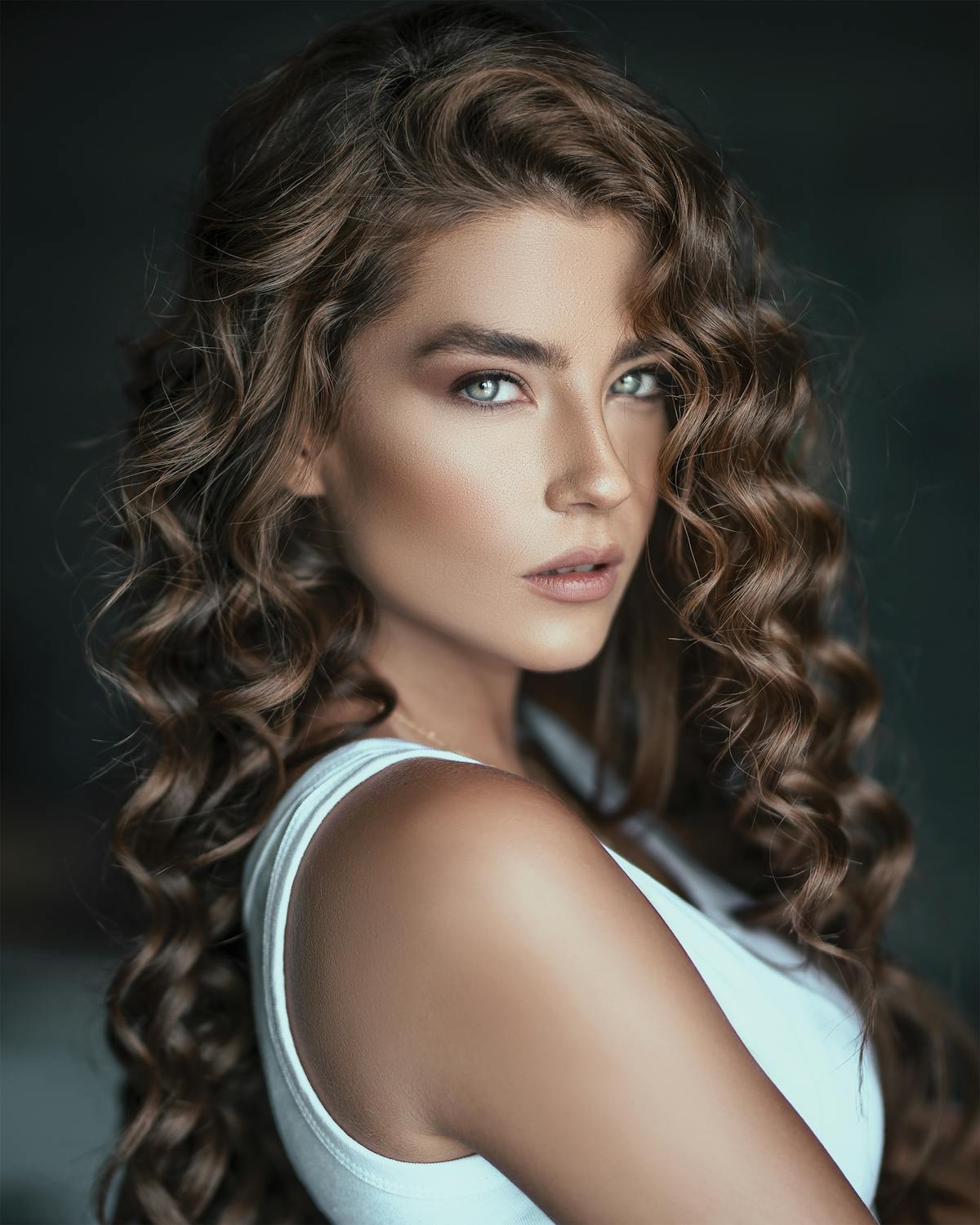 A lady with long curly hair