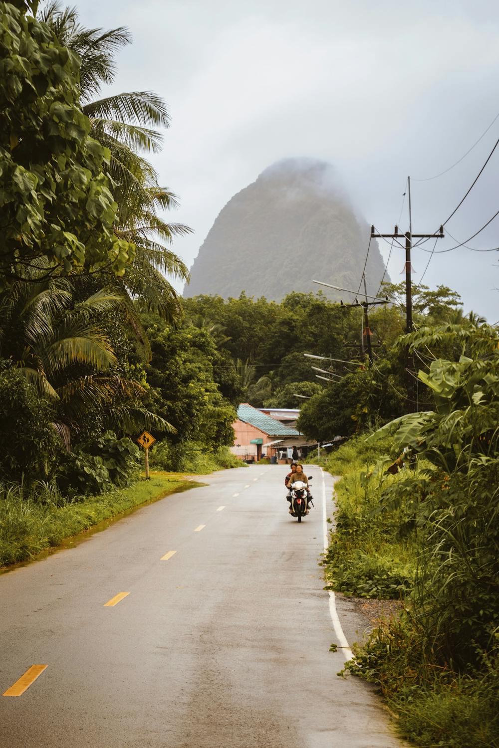 A person riding a motorcycle on a road

Description automatically generated