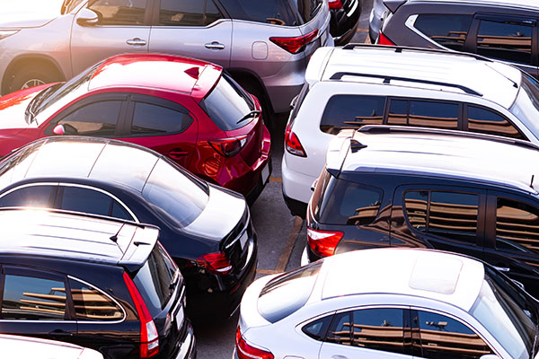 A collage of popular Japanese car models known for fuel efficiency